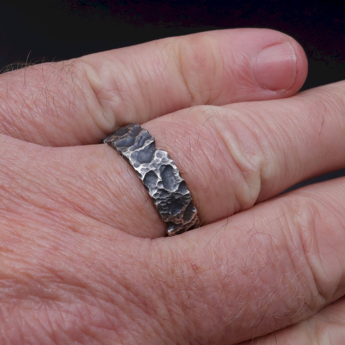 Lakeland Rock mens wedding, promise or engagement ring with a hand carved design.