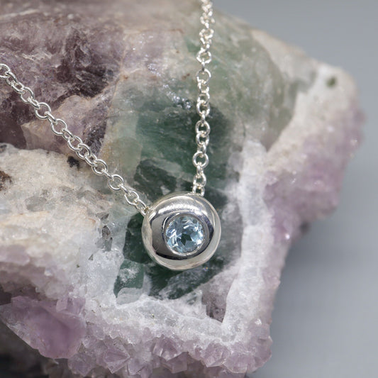 Blue Topaz runner pendant, silver slider button design, December Birthstone