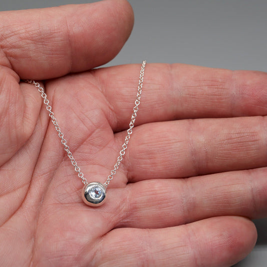 Blue Topaz runner pendant, silver slider button design, December Birthstone