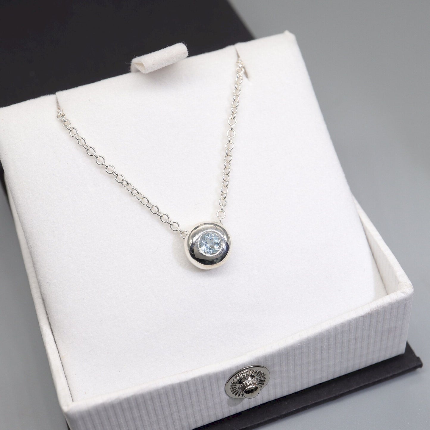 Blue Topaz runner pendant, silver slider button design, December Birthstone