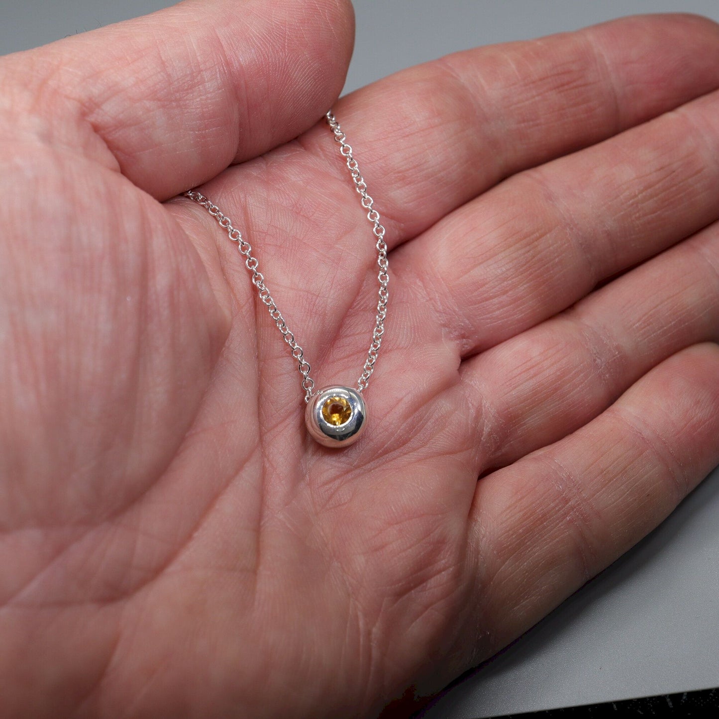 Citrine runner pendant, silver slider button design, November Birthstone