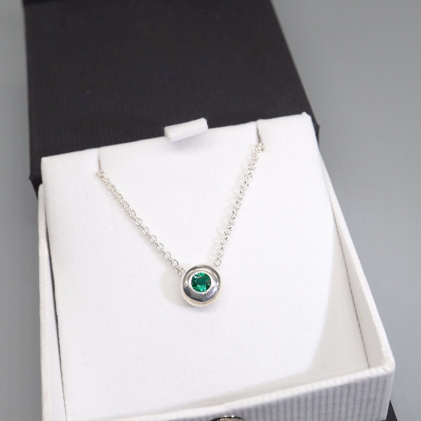 Emerald runner pendant, silver slider button design, May Birthstone