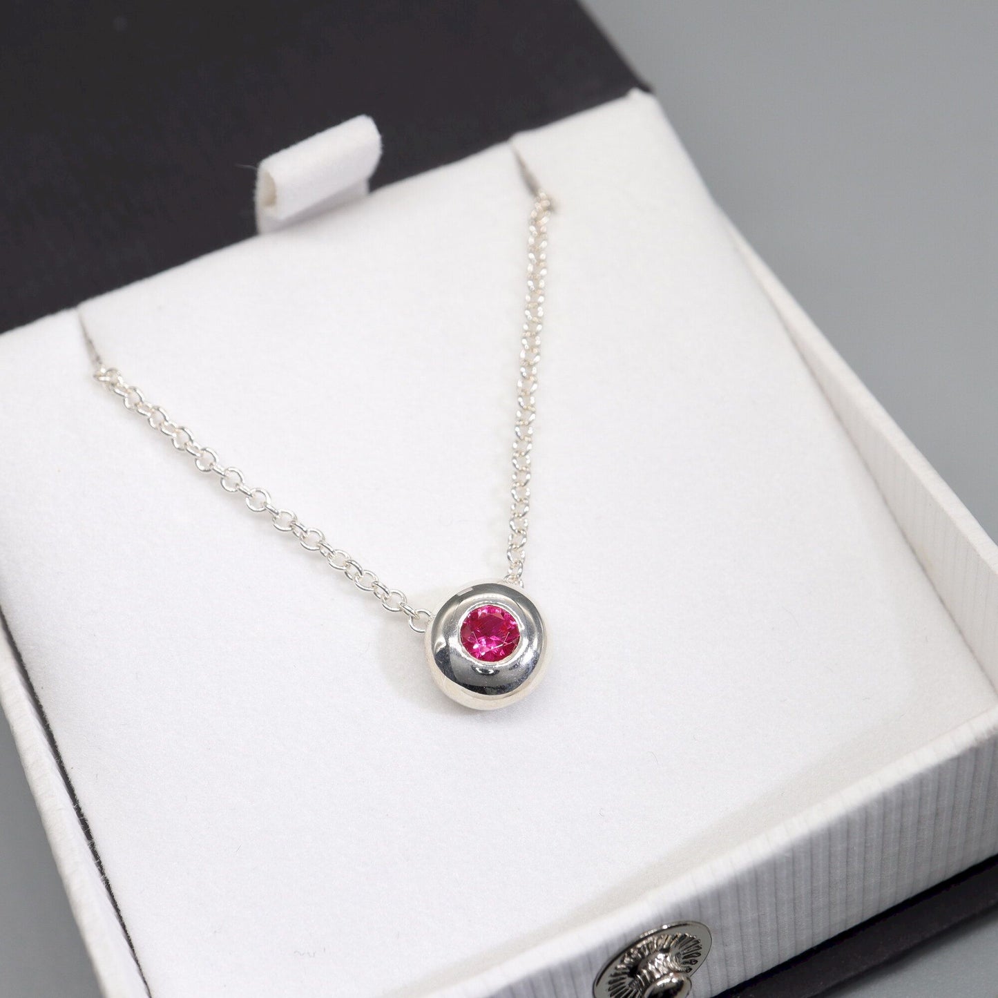 Ruby runner pendant, silver slider button design, July Birthstone