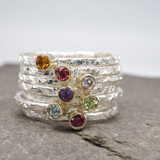 Birthstone stacking rings set in 18ct yellow gold and silver, Striding Edge design.
