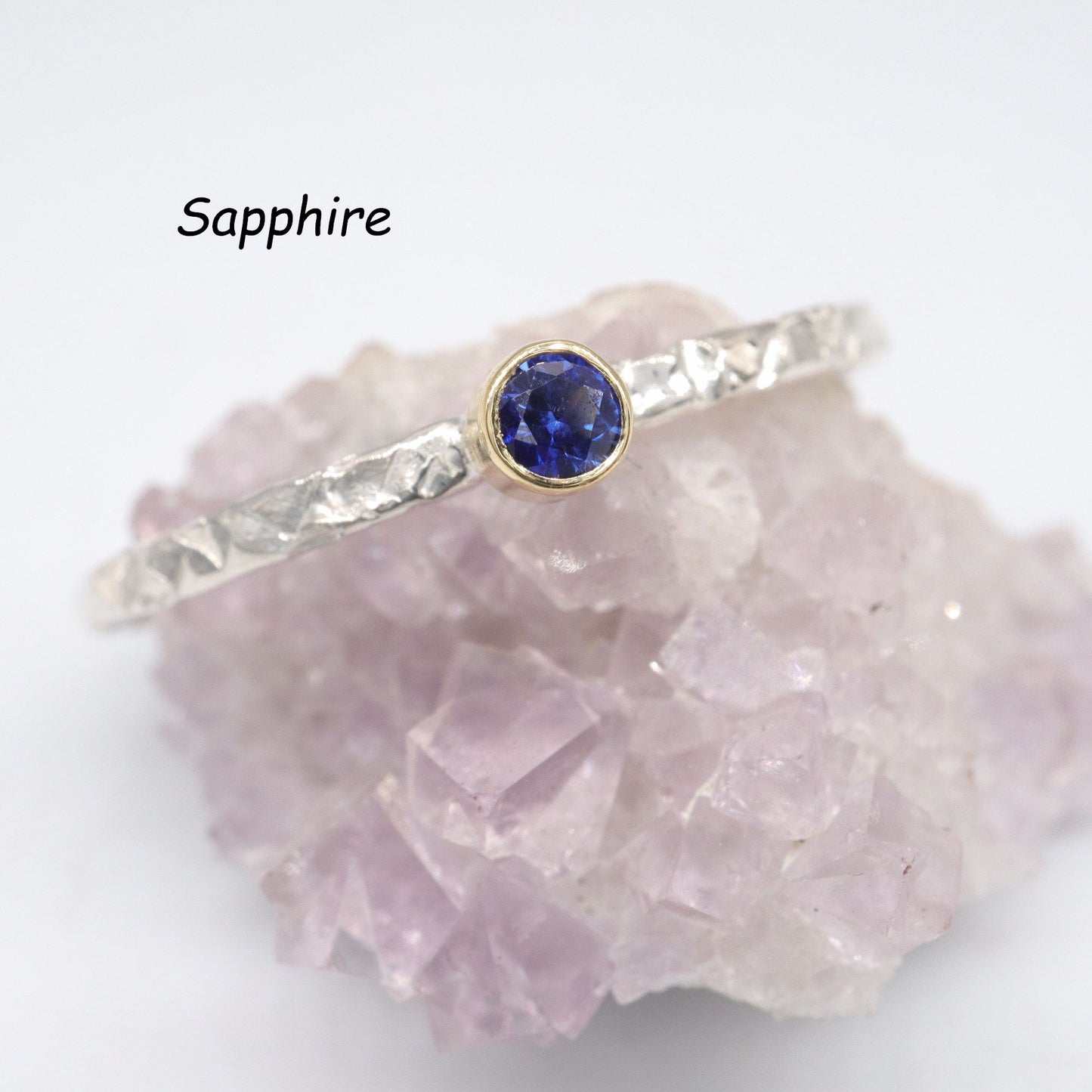 Birthstone stacking rings set in 18ct yellow gold and silver, Striding Edge design.