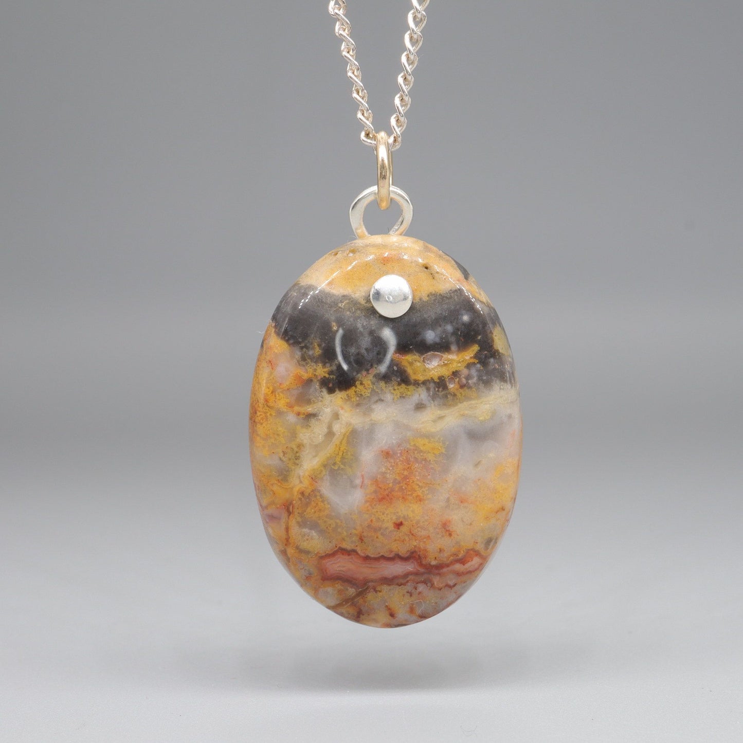 Orange and Black Lace Agate oval pendant