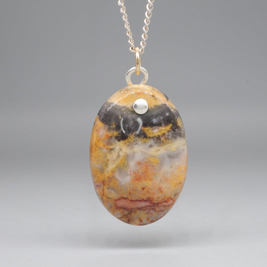 Orange and Black Lace Agate oval pendant