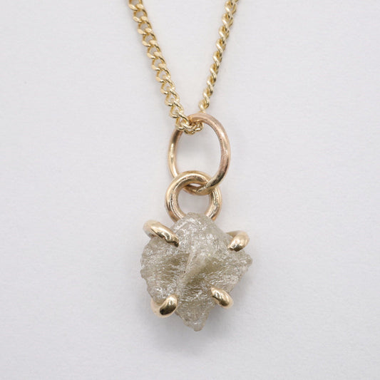 Diamond gold pendant set with one raw uncut natural diamond