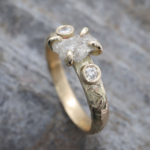 Diamond three stone gold ring.