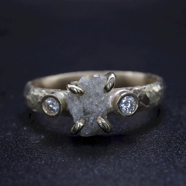 Diamond three stone gold ring.