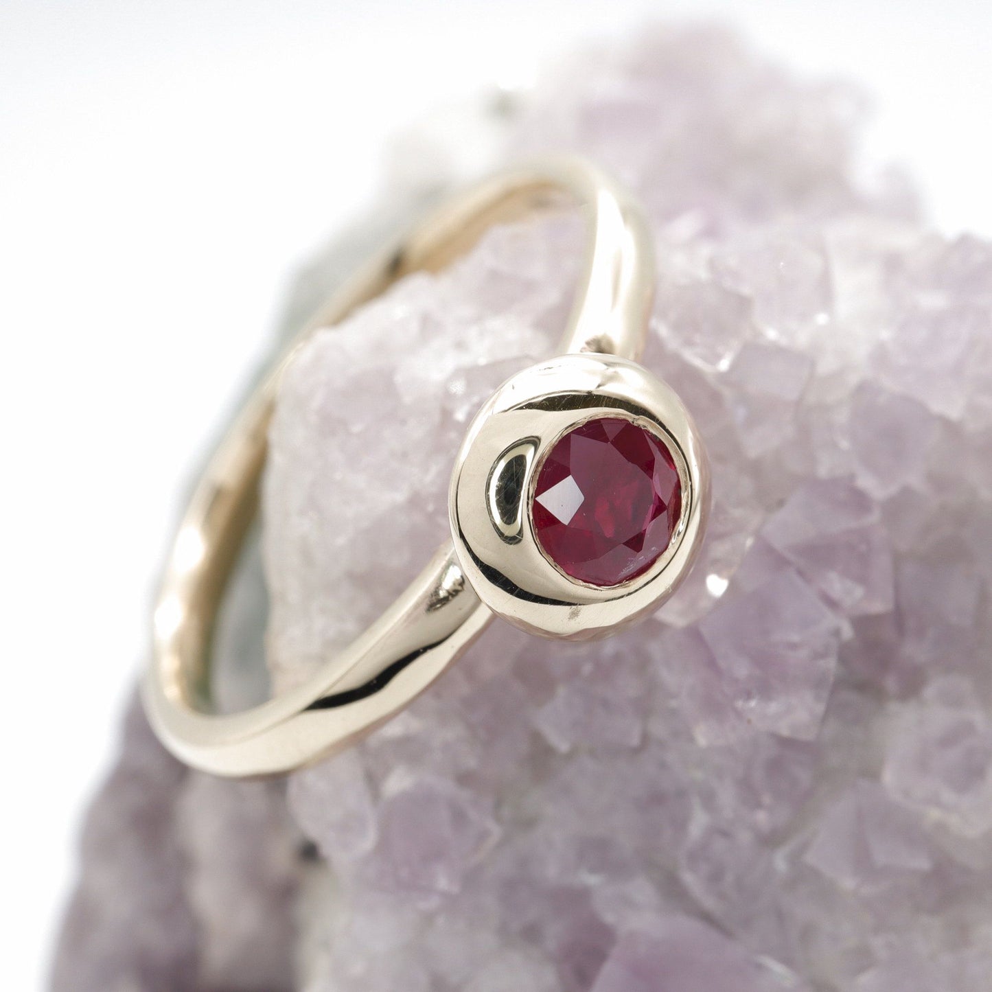 Solitaire fine Ruby engagement ring in yellow gold.