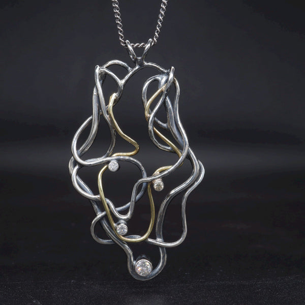 Diamond set 18ct gold and antique dark stained silver handmade Medusa necklace