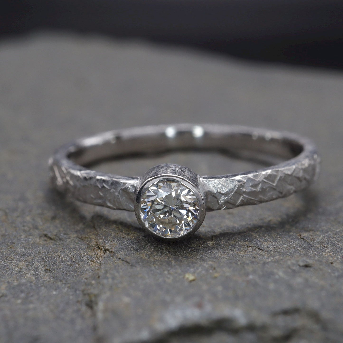Solitaire quarter carat diamond Fire design white gold ring