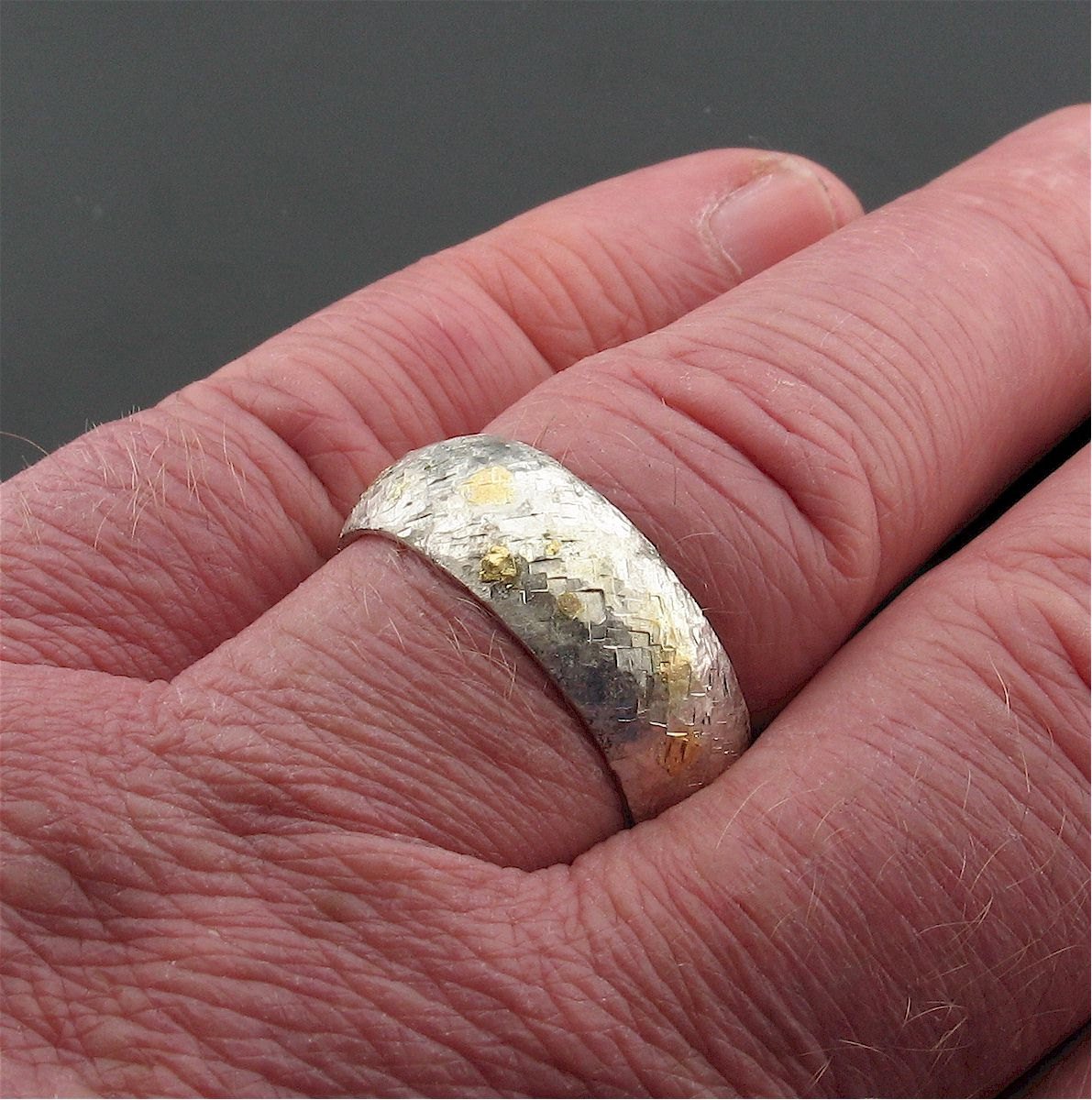 Silver and gold Morning View 8mm court wedding ring with rustic hammered surface. Original design handmade band for a man - Cumbrian Designs